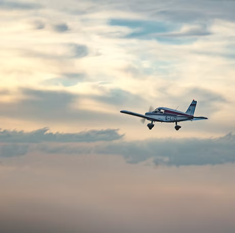Aircraft in flight at sunset from Sibson Aerodrome